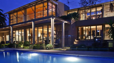 Evening Rear View - Evening Rear View - architecture, building, estate, facade, family car, home, house, landscape lighting, lighting, mansion, mixed use, property, real estate, residential area, swimming pool, villa, window, blue