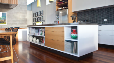 The kitchen island bench provides storage for both cabinetry, countertop, furniture, interior design, kitchen, white