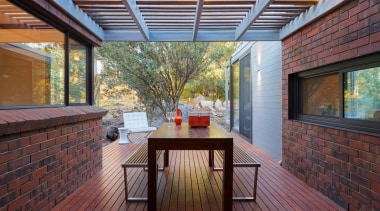 A view of the outdoor room - A architecture, daylighting, deck, hardwood, house, interior design, outdoor structure, patio, real estate, roof, wood, gray, red