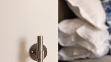 PBT20/50 - Solid Sprung Lever Handle Attached to furniture, product design, white