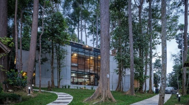 The raw, fair-face concrete wall experienced on the architecture, building, condominium, cottage, home, house, mixed use, neighbourhood, plant, real estate, residential area, tree, black