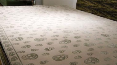 Instantly recognisable as a work of Alexander McQueen, bed sheet, design, floor, flooring, hardwood, interior design, pattern, property, tile, wall, wood, brown