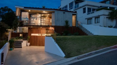 Yes, the home sits quite low from the apartment, architecture, building, estate, facade, home, house, property, real estate, residential area, roof, sky, villa, blue, black