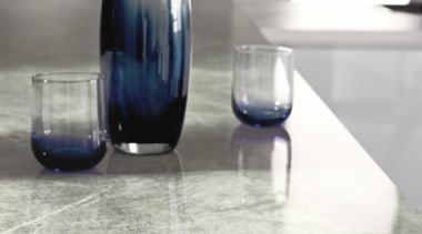 Warm and inviting, Soapstone Sequoia hasfinely drawn veins floor, flooring, furniture, glass, glass bottle, product design, table, tap, vase, gray