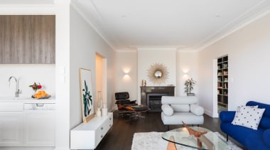 This lounge, adjacent to the kitchen, is the ceiling, floor, home, interior design, living room, property, real estate, room, wall, white