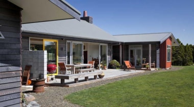 View of exterior with patio area and yellow backyard, cottage, estate, facade, farmhouse, home, house, property, real estate, siding, window, gray