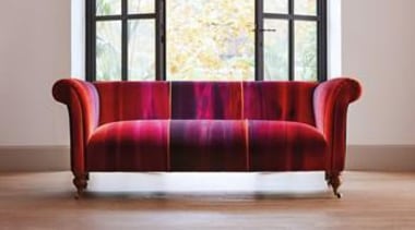 A Harlequin velvet that will make any piece angle, chair, chaise longue, coffee table, couch, floor, flooring, furniture, hardwood, interior design, living room, loveseat, product design, sofa bed, studio couch, table, wood, wood flooring, gray