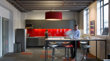 Red accents in the splashback, light shades, carpet furniture, interior design, office, table, black, gray
