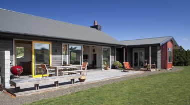 View of exterior with patio and yellow window cottage, estate, facade, farmhouse, home, house, landscape, property, real estate, blue