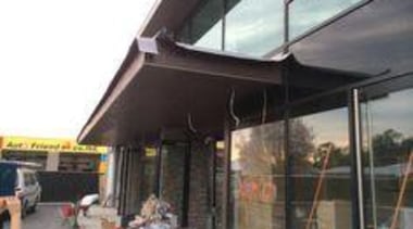 Exterior cladding featuring Oxide Moro. - Creyke House awning, canopy, roof, shade, black, white