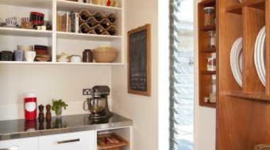 Kitchen with white cupboards, grey flooring and wooden cabinetry, furniture, interior design, kitchen, room, shelf, shelving, gray, brown