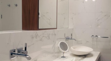 Downtown Penthouse Living - Downtown Penthouse Living - bathroom, bathroom accessory, bathroom sink, ceramic, countertop, floor, interior design, plumbing fixture, product design, room, sink, tap, tile, toilet seat, gray