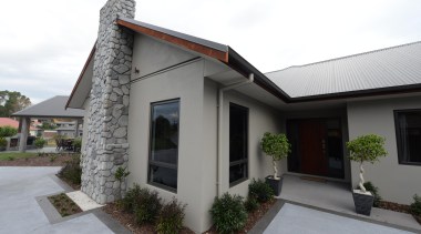 Concrete pre -cast panel home by Fowler Homes cottage, estate, facade, home, house, property, real estate, residential area, roof, window, white, gray