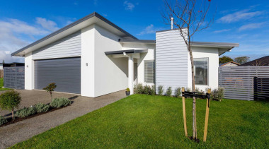 Two new homes by Fowler Homes Manawatu take cottage, elevation, estate, facade, grass, home, house, land lot, property, real estate, residential area, siding, sky, yard, brown