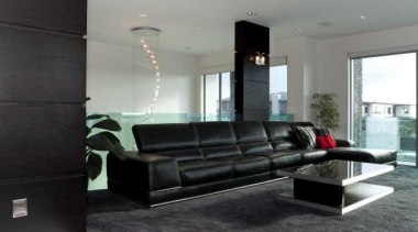 Living room with black feature and a black architecture, ceiling, floor, flooring, interior design, white, black