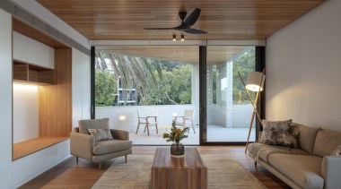 Timber ceilings, floors and joinery contrast the building's 