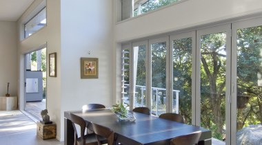 Bright dining area with wooden furniture - Landmark architecture, chair, daylighting, dining room, furniture, house, interior design, real estate, table, window, gray