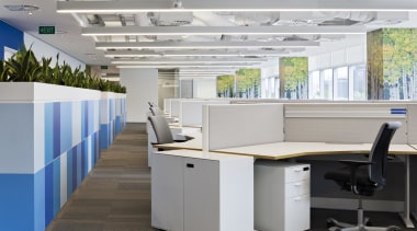 The Birch tree graphics adorn pillars at DNV desk, furniture, office, gray