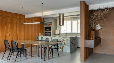 Open-plan living, dining, and kitchen with entry to 