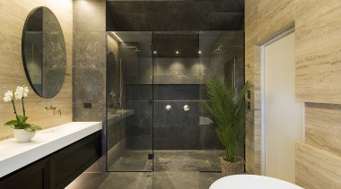 The warm materials and finishes in this bathroom 
