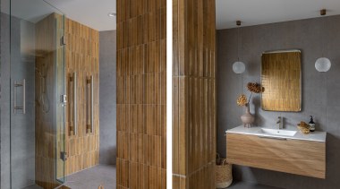 The budget-conscious guest bathroom is designed for mixed 