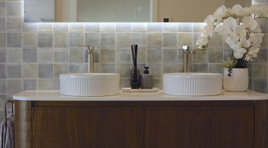 Designer: "Replacing the standard vanity with a timber 