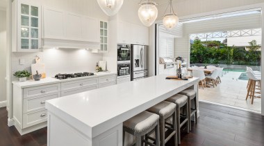 The brief for this kitchen was for a architecture, building, cabinetry, ceiling, countertop, cuisine classique, floor, flooring, furniture, hardwood, home, house, interior design, kitchen, laminate flooring, lighting, material property, property, real estate, room, table, tile, white, wood flooring, gray