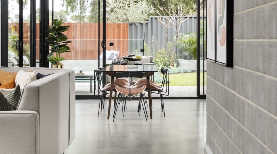 This innovative construction methodology has allowed the home apartment, architecture, building, ceiling, daylighting, door, floor, flooring, furniture, hall, home, house, interior design, loft, material property, orange, property, real estate, room, tile, window, wood flooring, gray