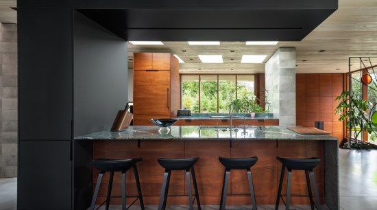 The kitchen island is framed by a wrap-over architecture, bar stool, building, cabinetry, ceiling, countertop, design, dining room, floor, flooring, furniture, hardwood, home, house, interior design, kitchen, kitchen & dining room table, lighting, material property, plywood, property, real estate, room, stool, table, tile, wood stain, black