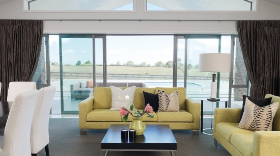 Remember, darker colours make a room appear smaller. ceiling, furniture, house, interior design, living room, property, real estate, room, table, window, window covering, window treatment, gray