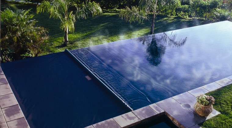 View of swimming pool and automatic pool cover backyard, estate, grass, landscape, leisure, nature, plant, property, real estate, reflection, reservoir, sky, swimming pool, tree, water, water feature, water resources, blue