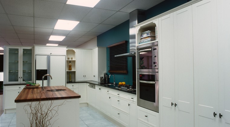 Showroom kitchen with white cabinetry, black benchtops, timber ceiling, countertop, interior design, kitchen, gray