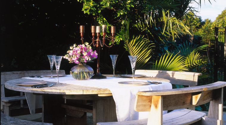 This quaint table setup can be ruined backyard, bench, chair, furniture, outdoor furniture, outdoor structure, patio, plant, table, tree, black