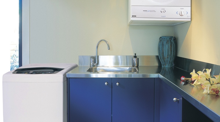 A laundry featuring a Smeg washing machine and bathroom, clothes dryer, home appliance, kitchen, laundry, laundry room, major appliance, product, product design, room, sink, washing machine, gray