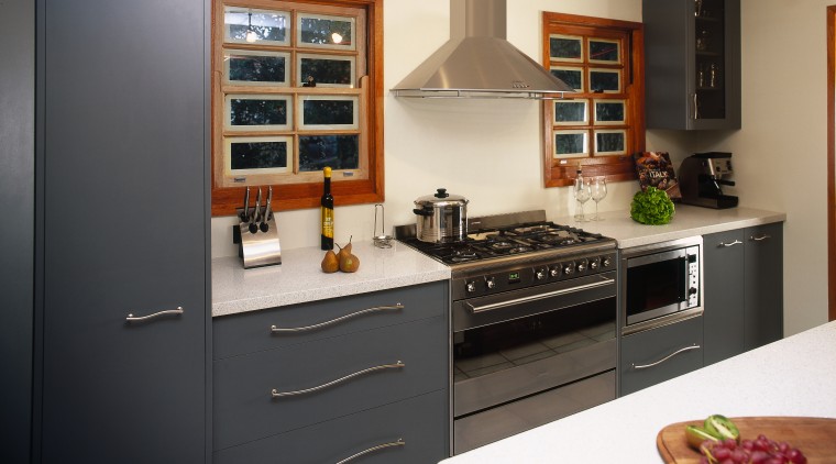 Kitchen with dark grey cabinetry and white benchtops cabinetry, countertop, cuisine classique, home appliance, interior design, kitchen, kitchen appliance, kitchen stove, room, black