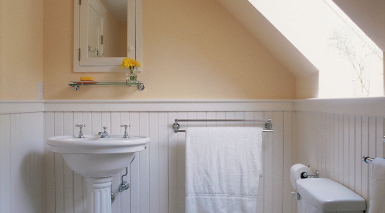 View of the bathroom installed with a skylight architecture, bathroom, bathroom accessory, bathroom cabinet, bathroom sink, bidet, daylighting, floor, home, house, interior design, plumbing fixture, product design, real estate, room, sink, tap, tile, toilet, toilet seat, wall, gray, brown