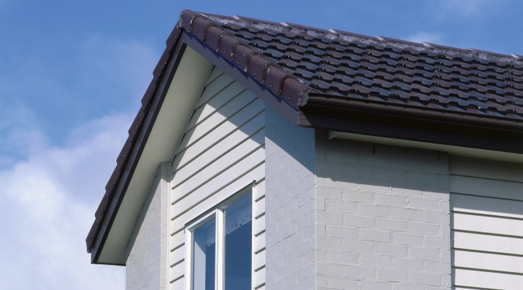 View of the cladding &amp; roofing of this building, daylighting, facade, home, house, roof, siding, sky, window, gray, blue