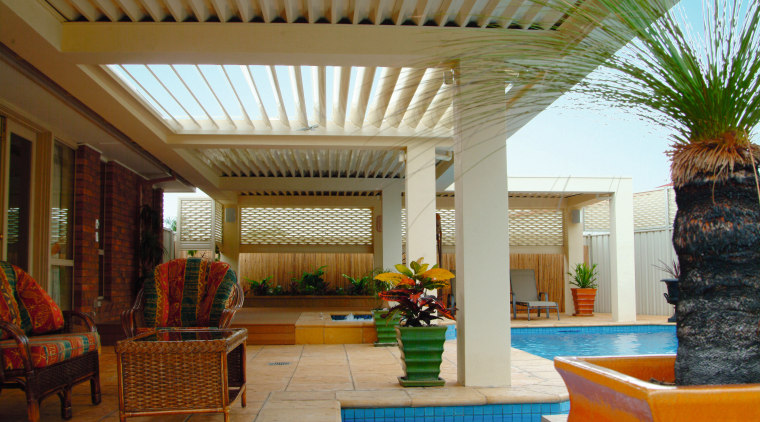 Exterior view of outdoor living and poolside area estate, interior design, outdoor structure, patio, property, real estate, resort, roof, swimming pool, brown