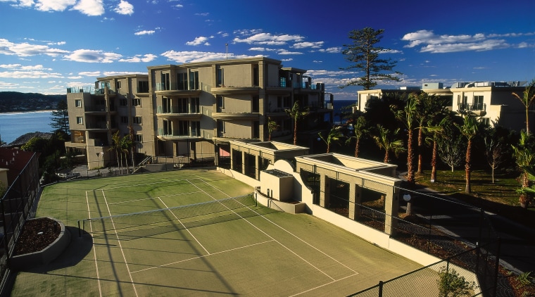 exterior view of tenis courts - exterior view apartment, architecture, building, campus, city, condominium, corporate headquarters, estate, mixed use, neighbourhood, property, real estate, residential area, roof, sky, structure, suburb, urban area, urban design, brown, black, blue