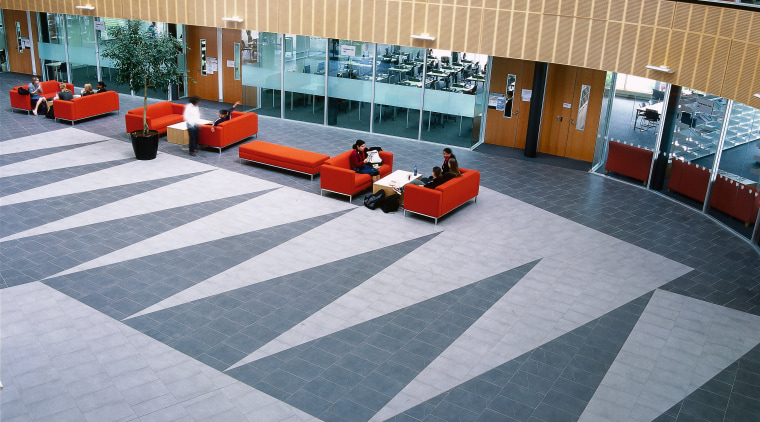 Tilework in main atrium of this building, with architecture, floor, flooring, roof, tile, gray