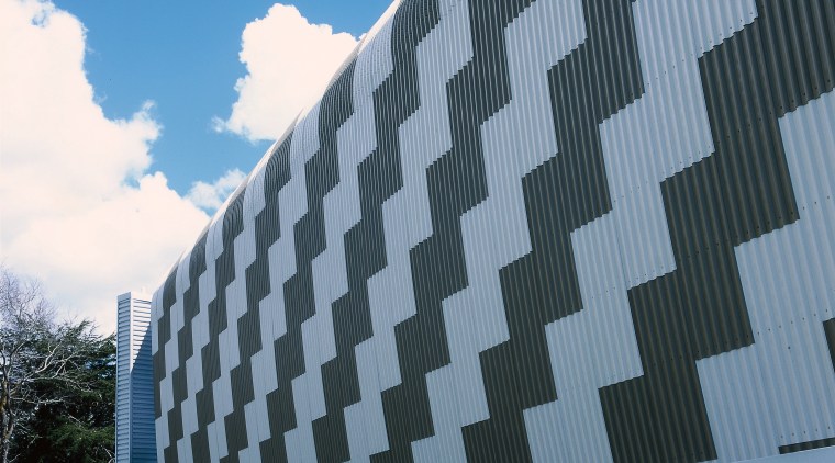 Exterior of building showing patterned design of steel architecture, building, commercial building, corporate headquarters, daylighting, daytime, facade, headquarters, landmark, metropolitan area, residential area, roof, sky, skyscraper, structure, tower block, teal, black