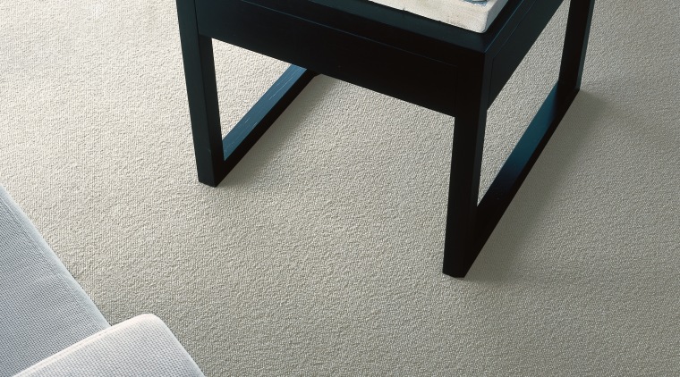 Black stool with chess set on natural coloured coffee table, floor, flooring, furniture, product design, table, gray, white