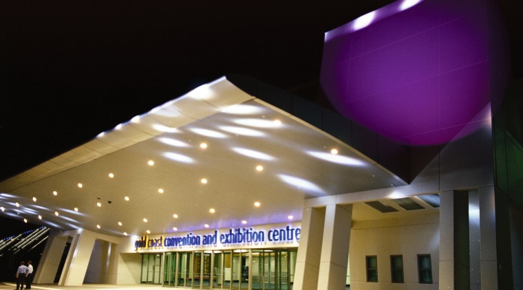 Night view of entrance of convention centre, with architecture, ceiling, daylighting, lighting, structure, black