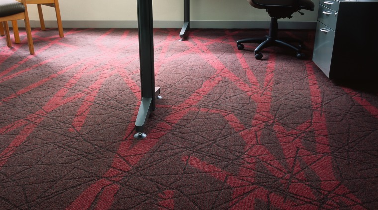 Textured carpet with red pattern in office with carpet, chair, floor, flooring, furniture, hardwood, laminate flooring, table, tile, wood, wood flooring, wood stain, black
