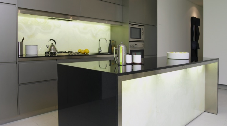 Showroom kitchen with grey cabinetry, dark stone benchtop, architecture, cabinetry, countertop, floor, interior design, kitchen, product design, property, real estate, gray