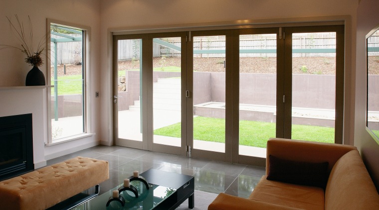 Lounge room with timber framed bifold doors leading ceiling, daylighting, door, interior design, living room, real estate, shade, window, window blind, window covering, window treatment, wood, brown