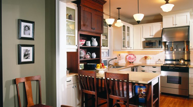 View of the kitchen and dining areas, green cabinetry, countertop, dining room, furniture, hardwood, home, interior design, kitchen, living room, room, table, brown