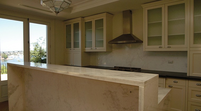 view of the kitchen shoing integrated marble and cabinetry, countertop, cuisine classique, estate, home, kitchen, real estate, room, window, brown