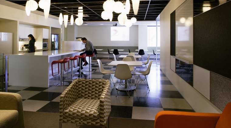 A view of the breakout area, green, brown furniture, interior design, office, restaurant, table, brown