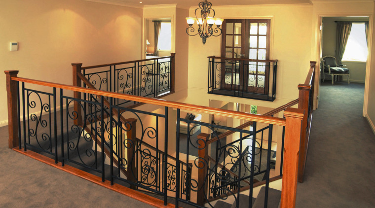 Stairway and landing with ornate iron balustrades, timber baluster, estate, floor, flooring, handrail, home, iron, property, real estate, stairs, orange, brown